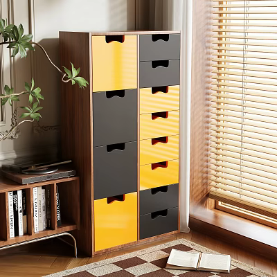 Modern Storage Cabinet with Yellow and Gray Drawers Near Plant and Bookshelf in Natural Light 3d model