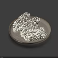 Tasty Pastry Pieces With White Creamy Topping And Dark Stripes On Silver Plate