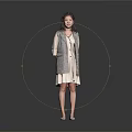 Smiling Woman In Gray Plaid Coat And White Dress Standing Against Gray Background