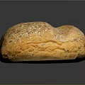 Fresh Round Multigrain Bread Loaf Topped With Sesame Flax And Sunflower Seeds