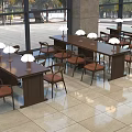 Spacious Indoor Setting With Long Wooden Tables And Chairs Adorned By White Lamps And Large Windows