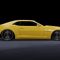 Yellow Chevrolet Sports Car With Sleek Modern Design And Custom Alloy Wheels