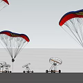 Red And Black Paragliders Flying In Blue Sky With White Clouds And Ground Equipment