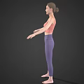 Woman wearing pink sports bra and purple leggings barefoot with arms outstretched against dark background