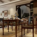 Cozy Dining and Living Room Interior With Wooden Table Tableware Vase Framed Pictures And Staircase
