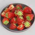Ceramic Plate Filled With Fresh Whole And Sliced Strawberries With Green Leaves