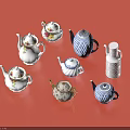 Assorted Ceramic Teapots And Kettle Dinnerware Set With Floral Blue Patterns On Red Background 3d model