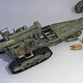 Military Artillery Weapon with Tracked Chassis and Cannon Barrel and Ammunition Shells
