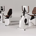 Stationary Exercise Bikes With White Frame Brown Seats And Control Panels For Home Gym