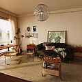 Cozy Living Room Interior With Black Sofa Green Plant Painting And Pink Cushion