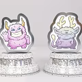 Two Cute Monster Figurines With Pink Purple Designs And Silver Speckled MONSTER Bases
