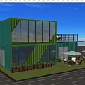 Modern Container Office With Green Blue Exterior Large Windows Terrace Outdoor Seating And Plants