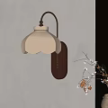 Elegant Wall Lamp with White Pleated Shade Brass Arm Wooden Base on Beige Wall