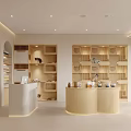 Modern Mall Store Interior With Curved Reception Desk Wooden Shelves Soft Lighting And Product Displays