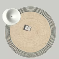 Beige Round Rug With Dark Border And Decorative Box Near White Ceramic Bowl