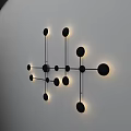 Modern Wall Lamp With Black Metal Frame And Illuminated Circular Lights Mounted On White Wall