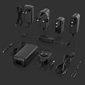 Electronic Power Adapters And Chargers With Various Plugs And Cords