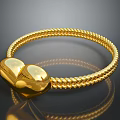 Golden Braided Bracelet With Heart Shaped Design And Smooth Shiny Surface Finish