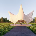 Modern Star Shaped Pergola With Tensile Membrane Surrounded By Green Fields And Wooden Walkway