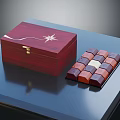 Elegant Decorative Ornament Set With Red Wooden Box Golden Decoration And Colorful Squares On Blue Tabletop