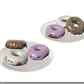 Colorful Donuts With Various Frostings And Sprinkles On White Plates