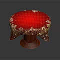 Red Round Tablecloth With Golden Patterns And Sparkling Decorations On Wooden Table