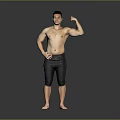 Shirtless Man Flexing Muscular Bicep In Black Shorts Against Gray Background