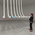 Hanging Silver Tubes Art Installation With Circular Ends And Blue Sphere In Indoor Space