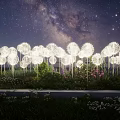 Dandelion Shaped Decorative Lights Illuminating Garden Under Starry Sky And Milky Way