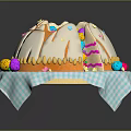 Round Dome Shaped Cake With White Frosting And Colorful Decorations On Blue White Checkered Napkin