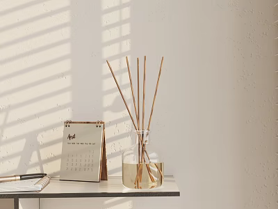 Minimalist Decorative Ornament Set With Calendar And Reed Diffuser On Sunlit Table 3d model