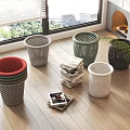 Colorful Household Waste Baskets on Wooden Floor With Stacked Magazines and Window Blinds