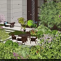 Lush Courtyard Garden Design With Various Green Plants Colorful Flowers And Outdoor Table Chairs