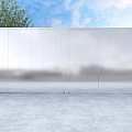 Modern Silver Metal Gate With Stone Pillars on Sides Against Blue Sky and Green Trees