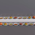 Various Types of Food on Multiple Patterned Plates with White Trays Including Meat and Vegetables