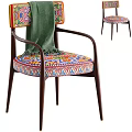 Vibrant Accent Chair With Colorful Patterned Seat Wooden Armrests And Green Throw Blanket