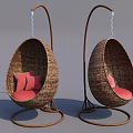 Two Wicker Egg Shaped Hammocks With Red Cushions And Metal Stands