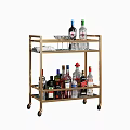 Modern Golden Two Tiered Bar Cart With Various Liquor Bottles And Glassware