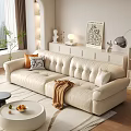 Cozy Living Room With Tufted White Leather Sofa Pillows Brown Blanket And Round Coffee Table