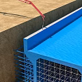 School Building Construction Site Featuring Steel Mesh And Blue Edge Design