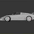 Shiny Silver Sports Car With Sleek Design Rear Spoiler And Alloy Wheels
