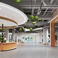 Modern Shopping Mall Lobby Interior With Circular Counter And Green Plants