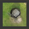 Traditional Wooden Windmill with Thatched Roof and Classic Wooden Structure on Green Grass Base