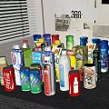 Assorted Colorful Beverages in Bottles and Cans Displayed Together