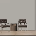 Two Brown Leather Leisure Chairs With Metal Frames And Wooden Side Table