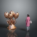 Large Bronze Tulip Sculpture Art Installation With Woman Viewing In Modern Space