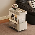 Modern Black Side Table With Flowers Coffee Cup Wine Bottle Radio And Books On Wheels