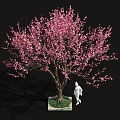 Pink Flowering Tree with White Base and Green Plants Near Human Figure Sculpture
