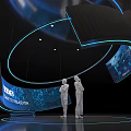 Modern Tech Exhibition Installation With Curved Structure Blue Lighting Screens And Silhouette Figures