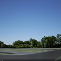 Modern Multi Storey Office Building With Glass Facade And Landscaped Surroundings